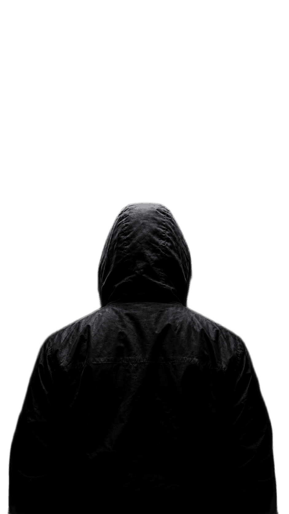 A hooded figure beneath a beam of light